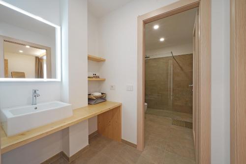 a bathroom with a sink and a shower at Agriturismo Hegemone in Tremosine Sul Garda