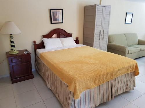Cama ou camas em um quarto em Maria Mulata Apartments