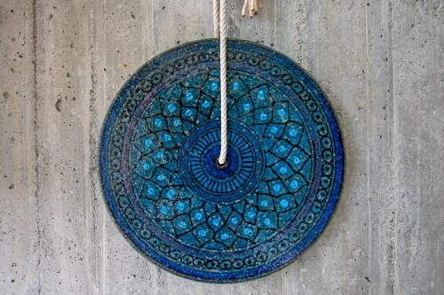 a blue plate on the side of a wall at Hotel Marina in Marina di Massa