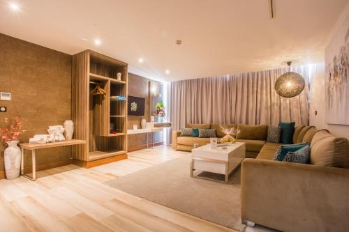 a living room with a couch and a table at SBN Suite Hôtel in Tangier