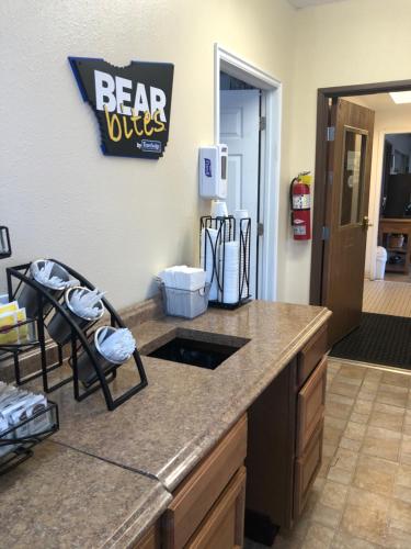 a kitchen with a counter with a barilts sign on the wall at Travelodge by Wyndham Elko NV in Elko