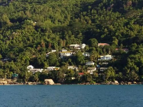 an aerial view of a home on the shore of a lake at Vi Miles Lodge in Mahe
