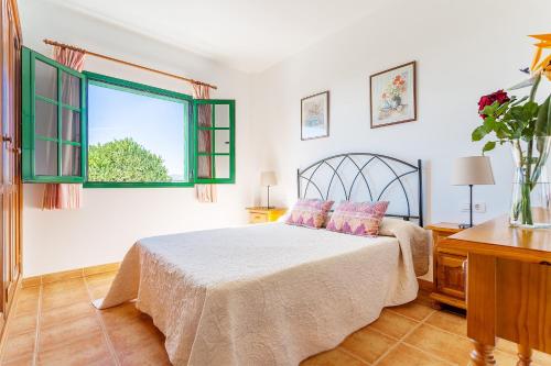 Ένα ή περισσότερα κρεβάτια σε δωμάτιο στο Apartamentos los Quiqueres
