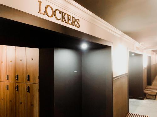 a locker room with a sign on the wall at Getaway Studios Gent in Ghent