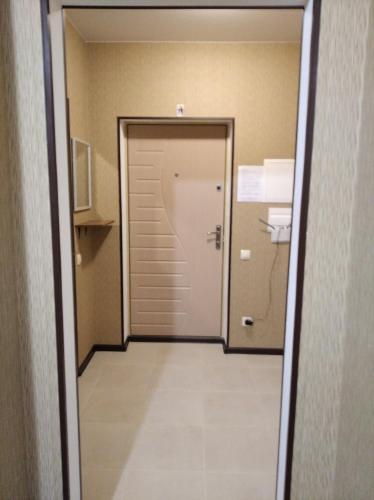 a door leading into a room with a hallway at Квартира в ЖК Атриум in Irpin'
