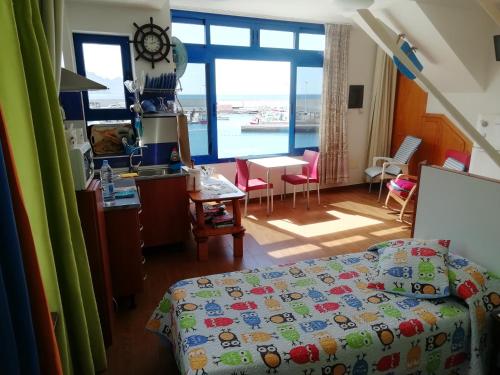 Ένα ή περισσότερα κρεβάτια σε δωμάτιο στο CasaPello SEAVIEW