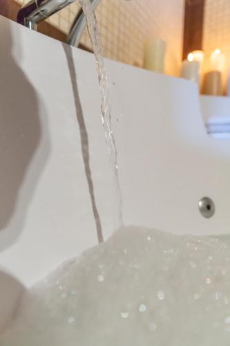Bagno di ROUGA Mountain Boutique Suites & Spa