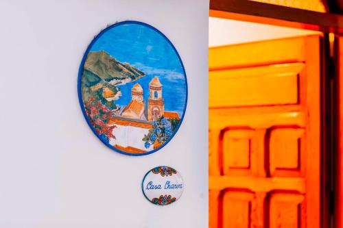 a mirror hanging on a wall next to a door at CASA CHIARINA breathtaking sea view in Ravello