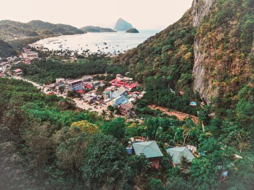 
a scenic view of a city with a mountain range at El Nido Viewdeck Cottages in El Nido
