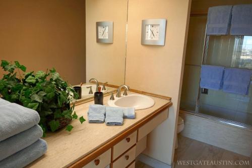 a bathroom with a sink and a mirror at WestgateAustin - Downtown Austin, Capitol Next Door, 30 Day Rental in Austin