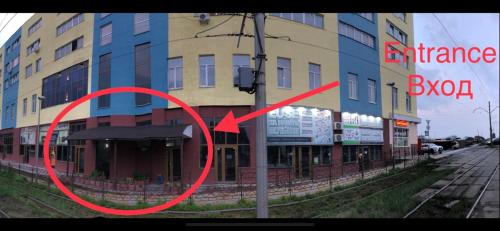 a picture of a building with a red arrow at Mega city in Kyiv