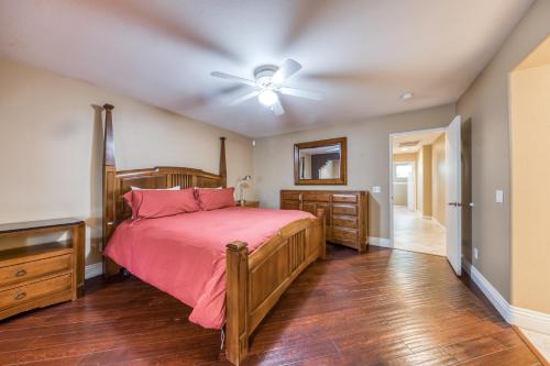 a bedroom with a bed and a ceiling fan at Tranquil Retreat Permit# 50437 in Indio