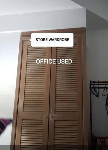 a sign that says store wandeper office used at CosY Klebang Homestay in Kampong Lereh