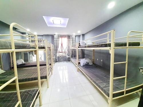 En eller flere senge i et værelse på Ba Sao Hotel