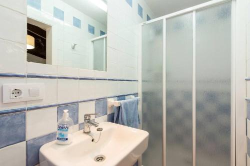 a bathroom with a sink and a shower at Chalet Cerca de la Playa in Cala'n Bosch