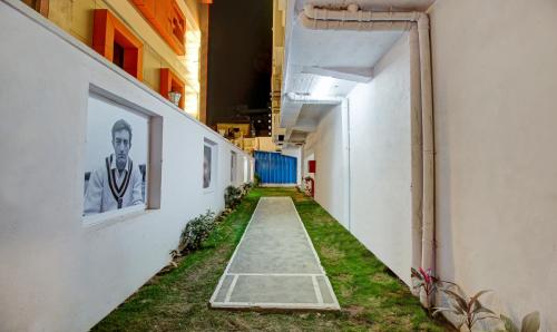 an empty hallway with grass on the side of a building at Treebo Trend The Pavilion in Nagpur
