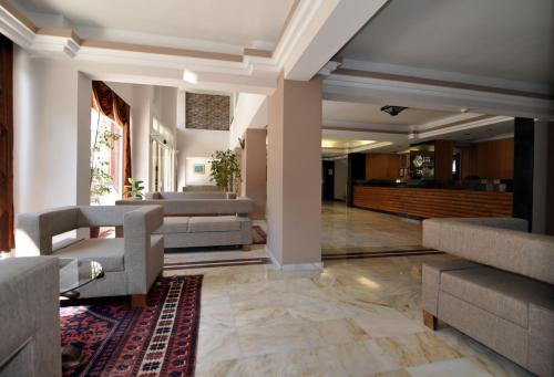 a lobby with couches and a living room at Surtel Hotel in Kusadası