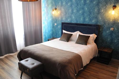 Postel nebo postele na pokoji v ubytování Hôtel L'ange de la vallée
