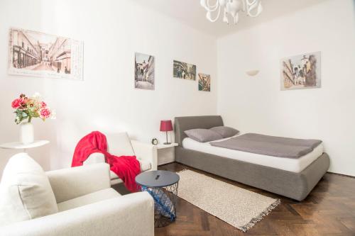 a living room with two beds and a couch at BASTINICA Superior Apartment, OLD TOWN in City CENTER in Zagreb