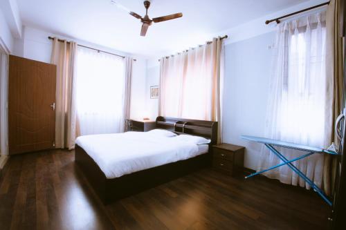 The Pines Serviced Residenceにあるベッド