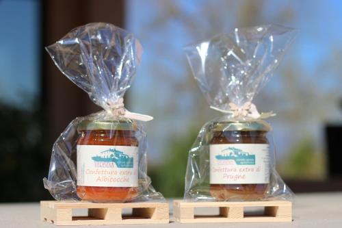 two bottles of honey in plastic bags on a table at Agriturismo Verbena in Castiglione del Lago