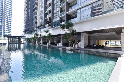 a swimming pool in the middle of a building at Kisetsu no ie, KLCC Kuala Lumpur in Kuala Lumpur