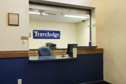 a view of a travelodge sign in an office at Travelodge by Wyndham Grand Island in Grand Island