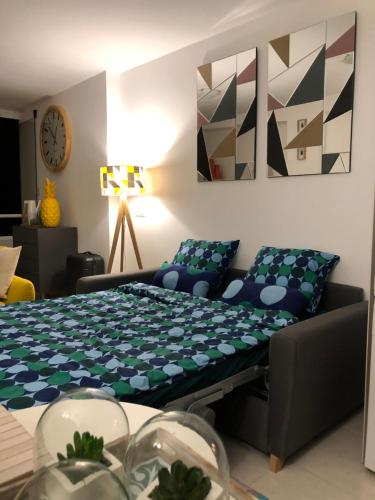 a living room with a bed and a couch at La Mata Beach - Studio - Appartement - Miramar XI - Torrevieja in Torrevieja