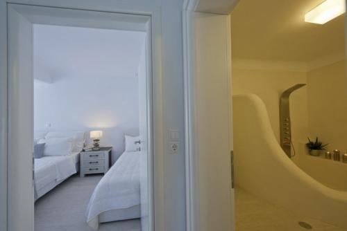 Ένα ή περισσότερα κρεβάτια σε δωμάτιο στο Paros Butterfly Villas