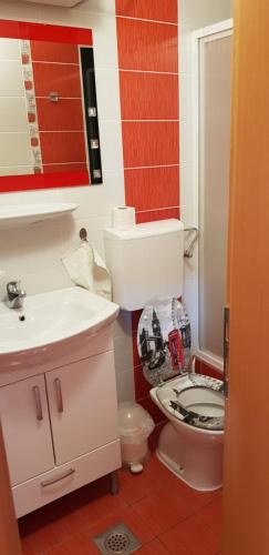 a bathroom with a toilet and a sink at Apartman Lejla in Orebić