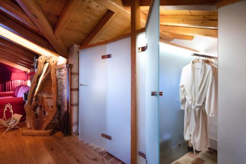 a room with white walls and wooden ceilings at Villa Madera by CorfuEscapes in Kompítsion