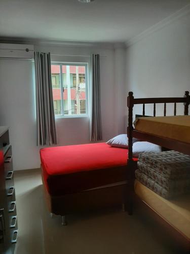 A bed or beds in a room at Estrela do Mar B