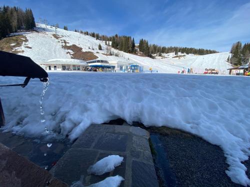 a pile of snow on the side of a road at Piccolo Nido Falcade in Falcade