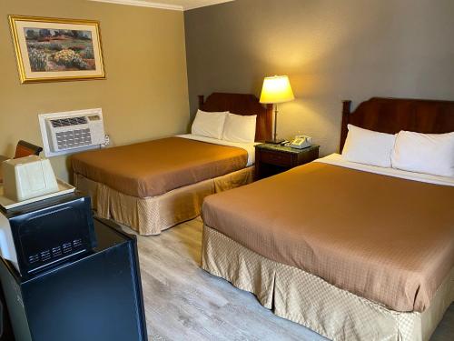 Ένα ή περισσότερα κρεβάτια σε δωμάτιο στο Travel Inn Snyder