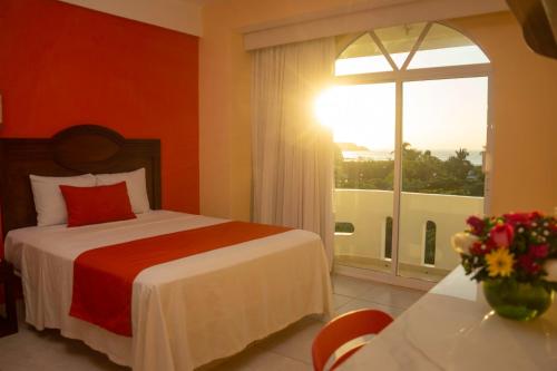 Кровать или кровати в номере Casa Danna Huatulco