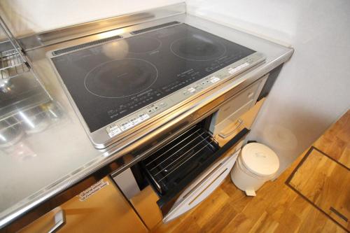 a stove top oven in a kitchen with at TRAD GUEST HOUSE KYOTO Kyomachiya in Kyoto