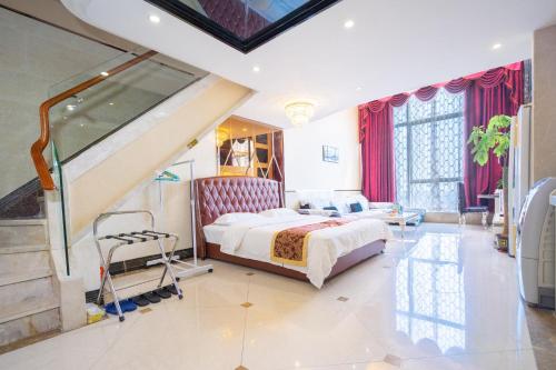 a bedroom with a large bed and a staircase at Guangzhou Hakka Apartment Beijing Road in Guangzhou