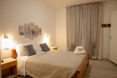 a bedroom with a large bed in a room at Infinity in Cervia