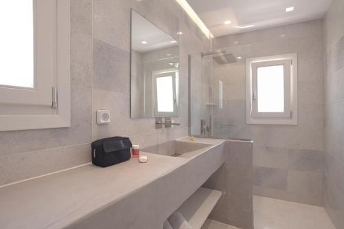 a large bathroom with a sink and a mirror at The view 3 in Santa Marina