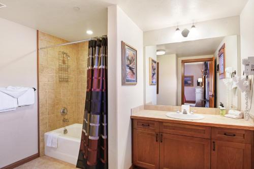 a bathroom with a sink and a tub and a shower at Oro Grande in Keystone