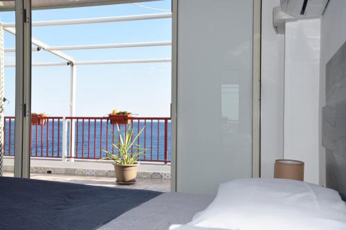 Ένα ή περισσότερα κρεβάτια σε δωμάτιο στο Ionio Sea Apartment