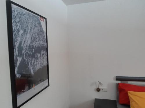 a large picture of a mountain on a wall at Apart Midi in See