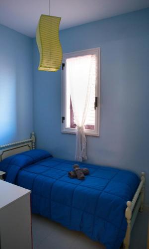 Ένα ή περισσότερα κρεβάτια σε δωμάτιο στο Casa Vacanze Soledad