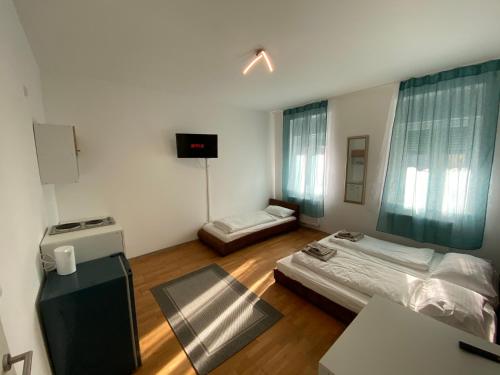 Postel nebo postele na pokoji v ubytování Apartments Graz