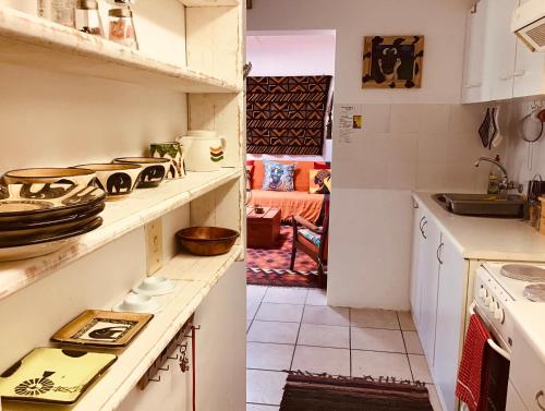 a kitchen with a sink and a counter top at Funky cottage in Hermanus