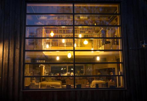 a window with a view of a dining room at Claron Lodge in West Wittering