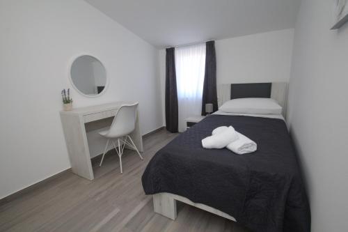 Luxury apartment Navi tesisinde bir odada yatak veya yataklar
