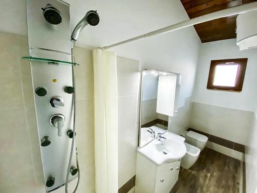a bathroom with a sink and a shower and a toilet at Atlantis in Crotone