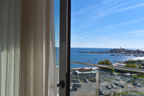 a view of the ocean from a room with a window at BARBETA Accommodation in Budva