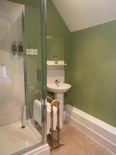 a bathroom with a sink and a shower at The Bell at Old Sodbury in Chipping Sodbury